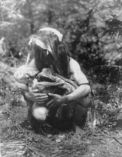 Preparing to eat the mummy, c1911. Creator: Edward Sheriff Curtis.