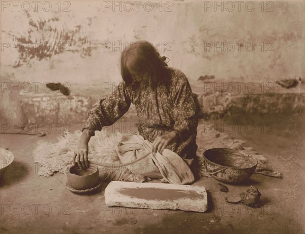 Zuni potter, c1903. Creator: Edward Sheriff Curtis.