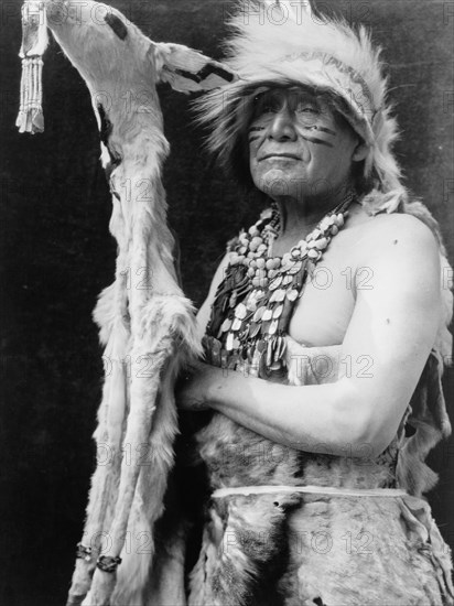 White deerskin dance costume-Hupa, c1923. Creator: Edward Sheriff Curtis.