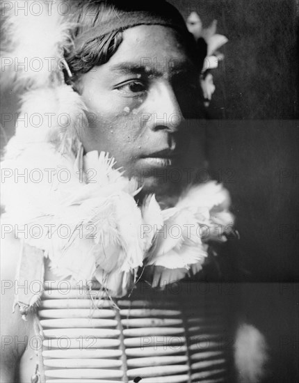 The Dancer, Crow Indian, head-and-shoulders portrait, facing right, c1905. Creator: Edward Sheriff Curtis.