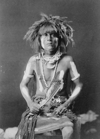 Honovi-Walpi snake priest, with Totkya Day painting, c1910. Creator: Edward Sheriff Curtis.