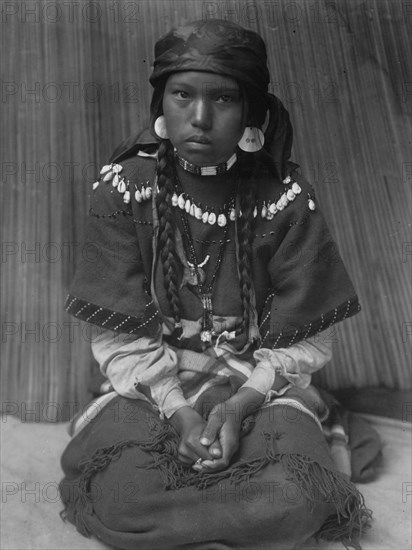 Touch her dress-Kalispel, c1910. Creator: Edward Sheriff Curtis.