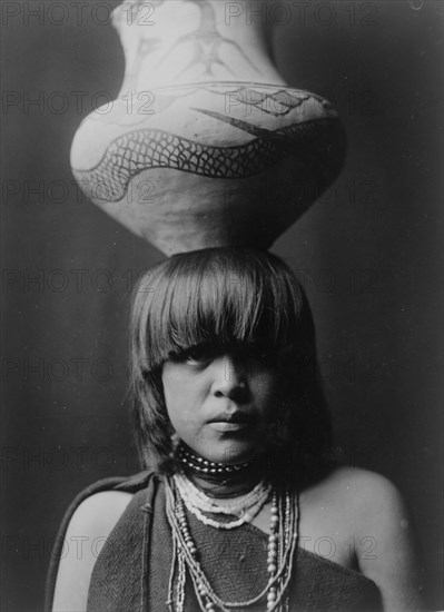 Girl and jar-San Ildefonso, c1927. Creator: Edward Sheriff Curtis.