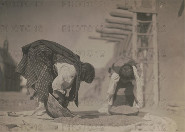 Cleaning wheat-San Juan, c1905. Creator: Edward Sheriff Curtis.