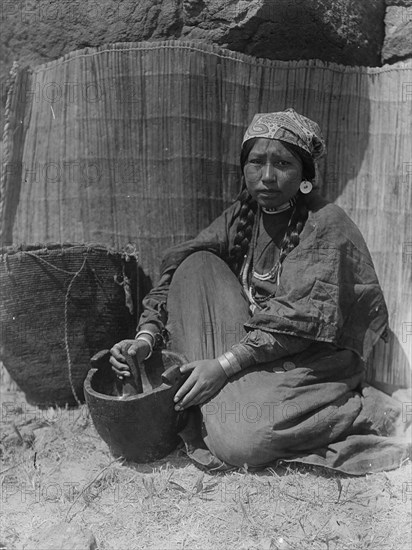 Pounding fish-Wishram, c1910. Creator: Edward Sheriff Curtis.