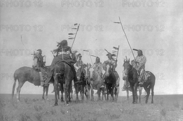 Atsina warriors, c1908. Creator: Edward Sheriff Curtis.