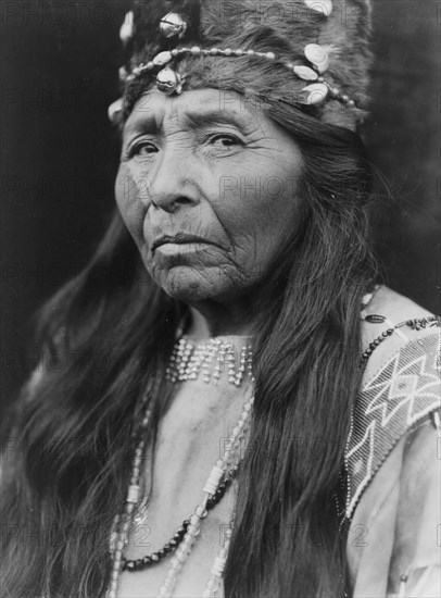 Klamath woman, head-and-shoulders portrait, facing left, c1923. Creator: Edward Sheriff Curtis.