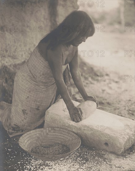 Maricopa Woman Mealing, 1907 Creator: Edward Sheriff Curtis.