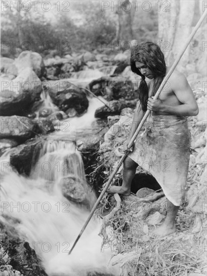 Watching for salmon-Hupa, c1923. Creator: Edward Sheriff Curtis.