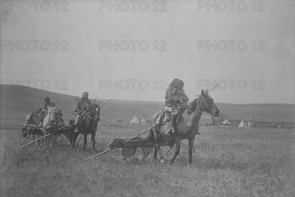 Moving camp-Atsina, c1908. Creator: Edward Sheriff Curtis.