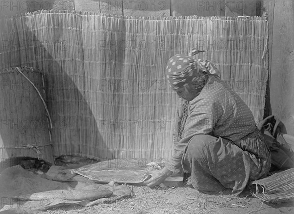 Preparing salmon-Wishram, c1910. Creator: Edward Sheriff Curtis.