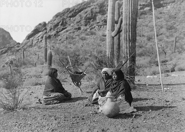 Qahatika women resting in Harvest Field-Qahatika, c1907. Creator: Edward Sheriff Curtis.