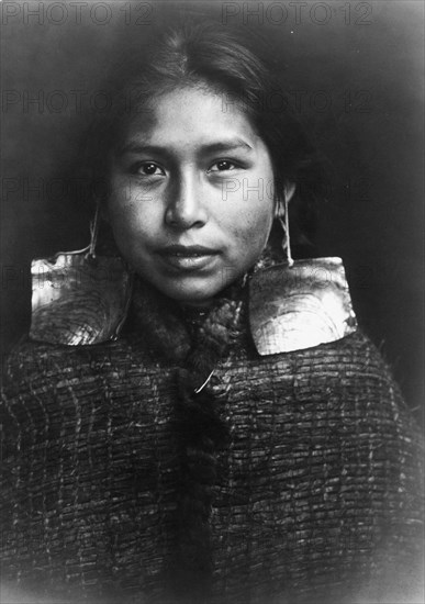 Tsawatenok girl, head-and-shoulders portrait, facing front, c1914. Creator: Edward Sheriff Curtis.