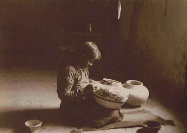Nunipayo [i.e. Nampeyo] decorating pottery, c1900. Creator: Edward Sheriff Curtis.