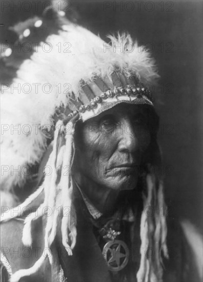 Calico - Oglala, head-and-shoulders portrait, facing right, between 1890 and 1910 Creator: Edward Sheriff Curtis.