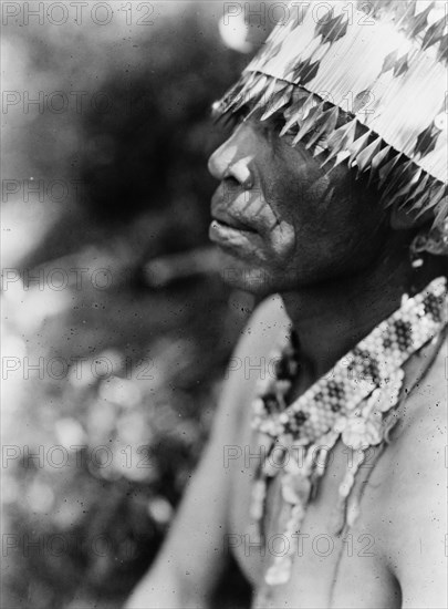 Coast Pomo with feather head-dress, c1924. Creator: Edward Sheriff Curtis.