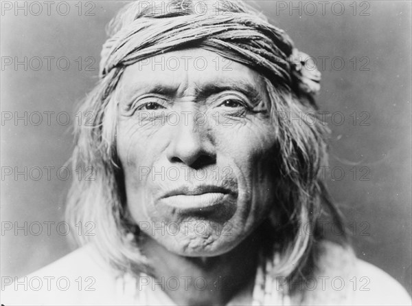 Head-and-shoulders portrait of Shiwawatiwa, a Zuni Indian, facing front, c1903. Creator: Edward Sheriff Curtis.