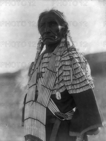 Slow Bull's wife, c1907. Creator: Edward Sheriff Curtis.