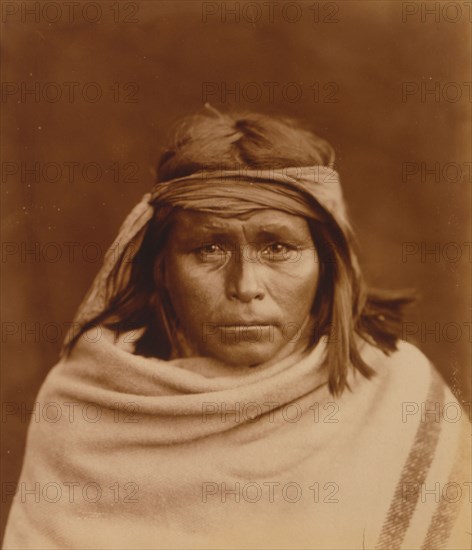 Tah-Lay, Apache? Indian, head-and-shoulders portrait, facing front, wearing blanket and..., c1903. Creator: Edward Sheriff Curtis.