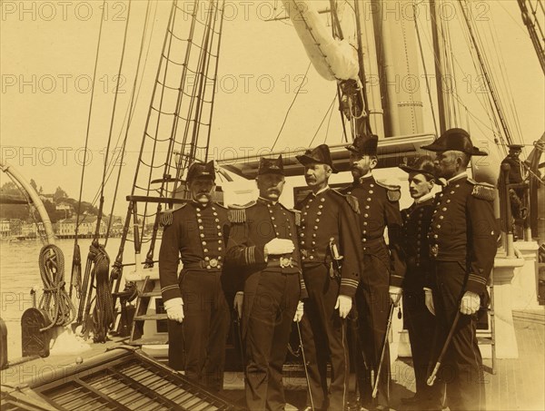 Six naval officers, full-length portrait, standing on deck of ship, 1894 or 1895. Creator: Alfred Lee Broadbent.