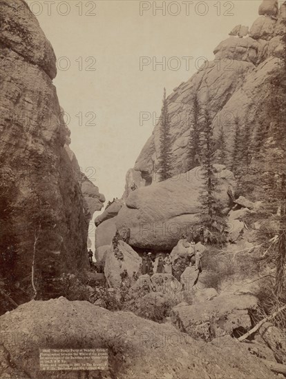 Our picnic party at Sunday Gulch Photographed between the walls of the grandest mountain..., 1891. Creator: John C. H. Grabill.