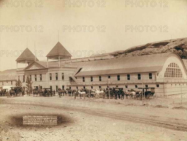 Hot Springs, SD Exterior view of largest plunge bath house in US on FE and MV R'y, 1891. Creator: John C. H. Grabill.