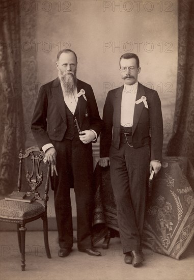 G.V. Yudin and V.I. Klochkov - bibliophile and St. Petersburg owner of an antique bookshop. 1890. Creator: Levitskii.