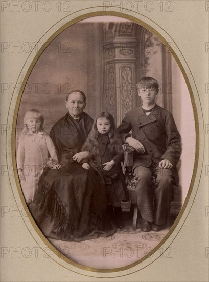 An elderly woman, a young man in a civilian suit and two.,, late 19th cent - early 20th cent. Creator: PA Milevskii.