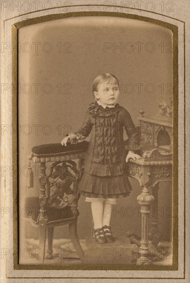 A girl in a dress and shoes, late 19th cent - early 20th cent. Creator: PA Milevskii.