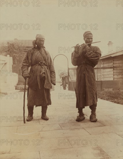 Two Chinese musician street performers in the upper yard, Dom Smith, Vladivostok, Russia, 1899. Creator: Eleanor Lord Pray.