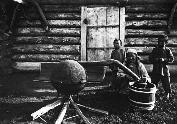 Woman preparing tarasun, 1890. Creator: Unknown.