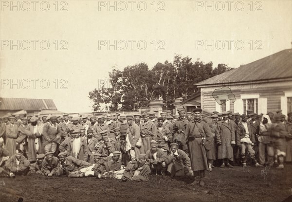 Group of convicts ready to embark on a prison barge, Tiumin [ie, Tiumen], between 1885 and 1886. Creator: Unknown.