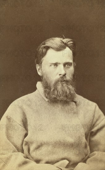 Half-length portrait of a man, dressed in convict clothing, facing right, between 1880 and 1886. Creator: Unknown.