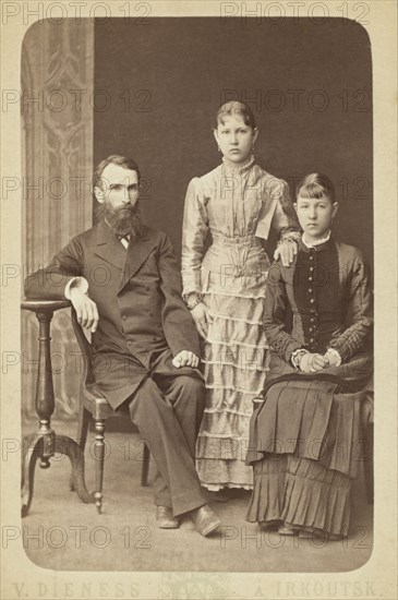 Family portrait of an unidentified man and his two daughters, 1885. Creator: Unknown.