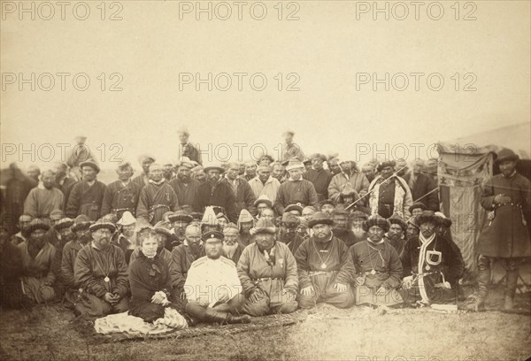 Kirghiz (ie Kazakh) tribesmen with a local Russian Governor and his wife, between 1885 and 1886. Creator: Unknown.