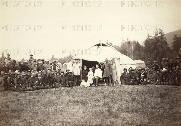 Group of Kirghiz (ie Kazakh) men posing with a local Russian Governor, his..., between 1885 and 86. Creator: Unknown.