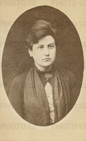 Head-and-shoulders portrait of woman, facing slightly right, between 1880 and 1886. Creator: Unknown.