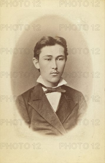 Half-length portrait of a young man, facing slightly right, between 1870 and 1886. Creator: Unknown.