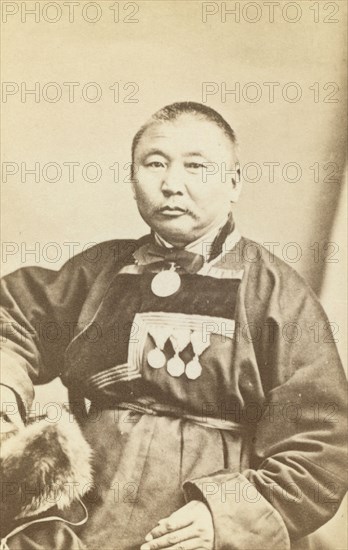 Half-length portrait of man, seated, facing slightly left, between 1870 and 1886. Creator: Unknown.