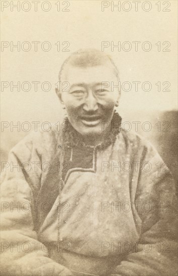 Half-length portrait of man, seated, facing front, between 1870 and 1886. Creator: Unknown.