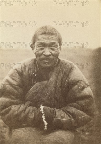 Half-length portrait of man, seated, facing front, between 1870 and 1886. Creator: Unknown.