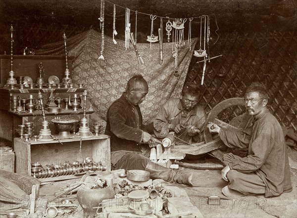 Buryat mechanics making "burkhanov" - Buryat goods, 1895-1939. Creator: L Veniukov.