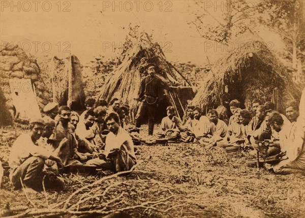 Exiled Convicts Having Lunch near Their Huts during Work in the Taiga, 1880-1899. Creator: Innokenty Ignatievich Pavlovsky.