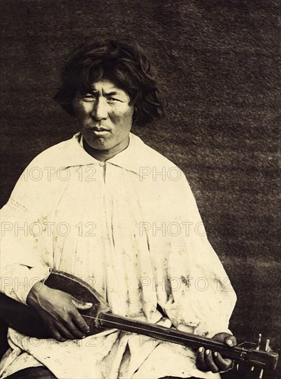 The Kachins Young Foreigner with a Musical Instrument Called a "Komuz", 1894. Creator: Unknown.