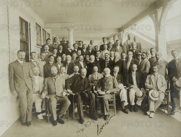 Russians & newspaper men - Sergei Witte, Baron Rosen with their suite and newspaper men, 1905. Creator: Perry Enoch Conner.