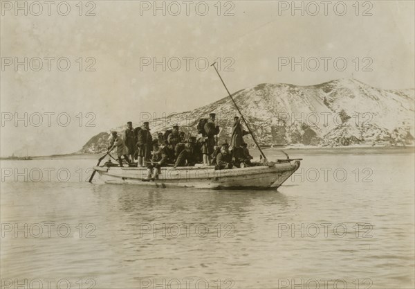 Squad of sappers and miners coming ashore in a sampan at Chemulpo, c1904. Creator: Robert Lee Dunn.