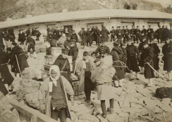 Japanese cavalry troops watching over their supplies on the beach at Chemulpo, 1904. Creator: Robert Lee Dunn.