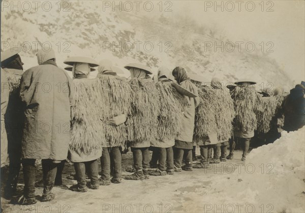 Japanese coolies in winter costume, c1904. Creator: Robert Lee Dunn.