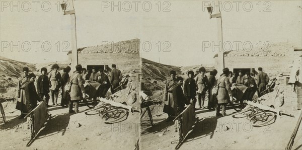 Bicycle stretchers bringing Russian wounded to a surgical station -- siege of Port Arthur, c1905. Creator: Underwood & Underwood.