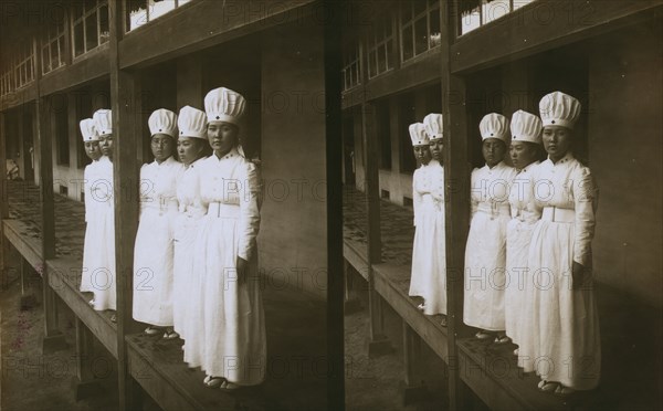 Japanese nurses attending to wounded soldiers in a hospital ward, c1905. Creator: Underwood & Underwood.